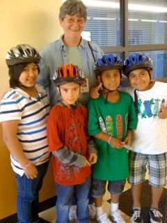Jose (in green) and helmeted friends with Nancy Nelson, WashCo BTC volunteer.